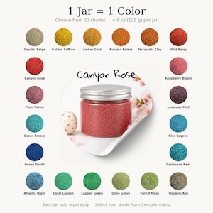 Labeled Canyon Rose, surrounded by 20 labeled sand swatches: Coastal Beige, Golden Saffron, Amber Gold, Autumn Ember, Terracotta Clay, Wild Berry, Canyon Rose, Raspberry Bloom, Plum Velvet, Lavender Mist, Ocean Breeze, Blue Lagoon, Ocean Depth, Caribbean Reef, Atlantic Night, Coral Lagoon, Lagoon Green, Olive Grove, Forest Moss and Volcanic Ash. Text: 1 Jar = 1 Color, choose from 20 shades, 4.4 oz per jar, each jar sold separately, select your shade from the color menu.