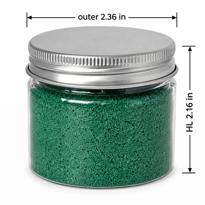 Closed clear jar of Lagoon Green colored quartz sand in an emerald green, with a silver metal screw lid, with measurement lines showing an outer diameter of 2.36 in (6 cm) and a height of 2.16 in (5.5 cm), on a white background.