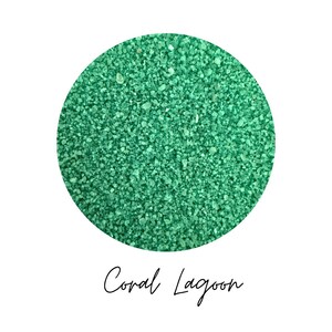 Close-up circle swatch of Coral Lagoon jade green craft sand with the color name written below