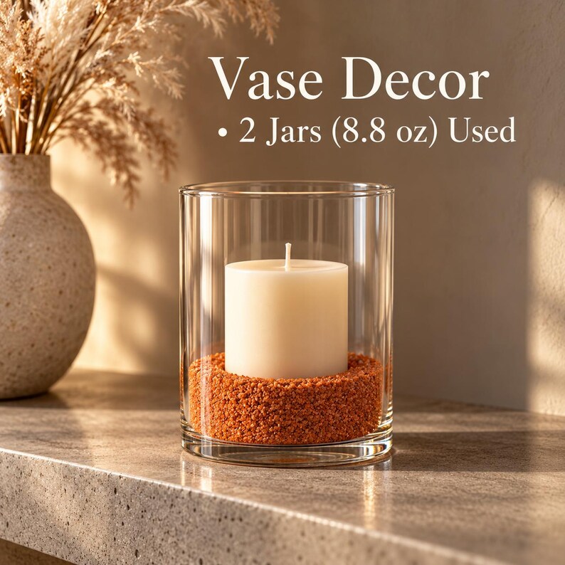 Vase decor featuring a pillar candle surrounded by Terracotta Clay colored quartz sand
inside a glass cylinder, perfect for dry terrarium styling.