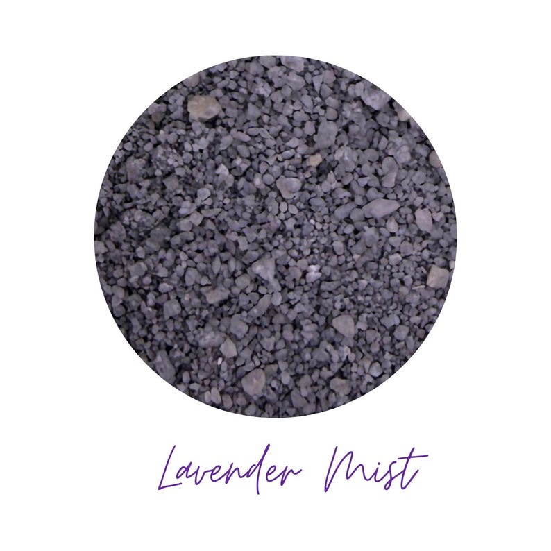 Close-up circle swatch of Lavender Mist gray-purple craft sand with the color name written below