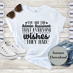 May include: White t-shirt with black text that reads "You are the Admin Assistant that everyone wishes they had". The shirt is laying on a wooden surface with a pair of sunglasses, white sneakers, and a stack of blue jeans.