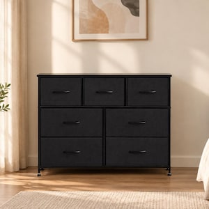 May include: A black storage dresser featuring a metal frame and seven fabric drawers. The top row consists of three smaller drawers, while the bottom two rows contain four larger drawers. Each drawer is equipped with a thin black handle.