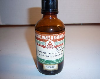 BW - 1950's Magnus Mabee & Reynard Camphor Oil 4 oz  New York 5 1/8 inch amber medicine bottle