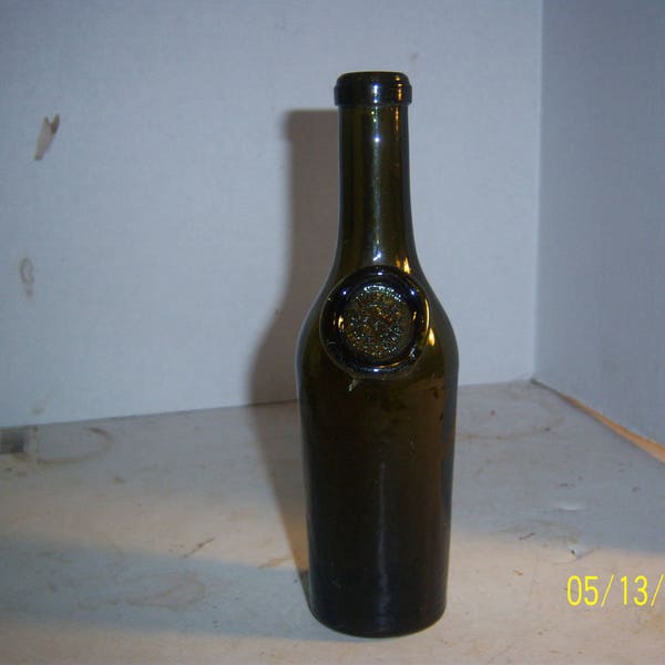 1890's J.M. Oliver & Sons 7 1/8 inch olive green sealed wine or olive oil bottle