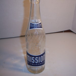 May include: A clear glass bottle with a blue and white label that reads "Mission of California" and "King Size".