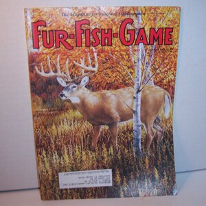 May include: A magazine cover with the title "Fur-Fish-Game" in red letters. The cover features a buck with large antlers standing in a field with trees. The background is a mix of fall colors.