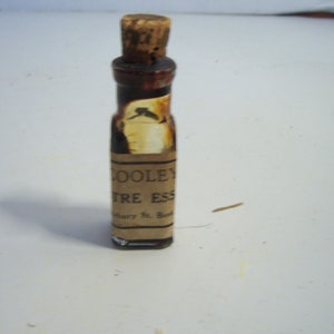 1890's L. Cooley, Boston, Mass Lustre essence Medium Paint 1 7/8 inch tall Clear Bottle with paper label