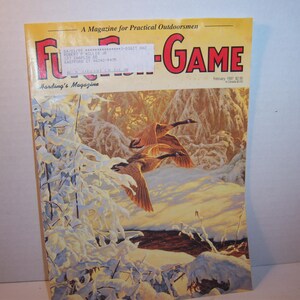 May include: A vintage copy of Fur-Fish-Game magazine from February 1997. The cover features a painting of geese in flight over a snowy landscape. The magazine's title is in red and the background is a warm, golden hue.