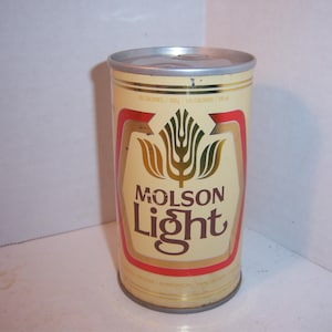 May include: A vintage aluminum can of Molson Light beer. The can is yellow with a red band and features a gold wheat stalk design with a gold and white tulip.