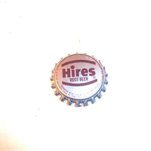 May include: Silver bottle cap with a red "HIRES ROOT BEER" logo.