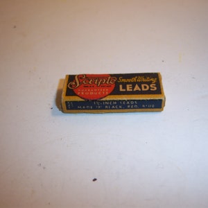 May include: A small box of Scripto Smooth Writing Leads, 1/4-inch leads, made in black, red, and blue.