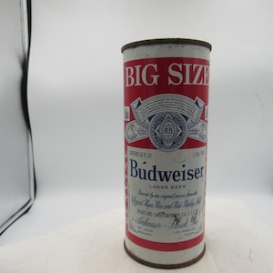 May include: Vintage Budweiser Lager Beer can with a red and white design. The can reads "BIG SIZE" at the top and features the Budweiser logo and text. The can is cylindrical and appears to be made of metal.