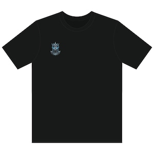 May include: A black short-sleeved t-shirt featuring a small graphic on the upper left chest. The graphic depicts a detailed, dark, metallic knight helmet with glowing blue eyes and a crown-like top, rendered in shades of grey, black, and blue.