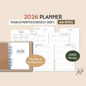 Può includere: Un'agenda ad anelli A6 color beige con pagine interne bianche. L'agenda include layout annuali, mensili e settimanali per il 2026. Pagine aggiuntive includono attività principali, note e pagine settimanali a righe. Il testo "2026 Planner" è visibile.