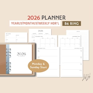 Peut inclure: Un agenda B6 à anneaux pour 2026 avec des présentations annuelles, mensuelles et hebdomadaires. L'agenda comprend des pages pour les tâches principales, les calendriers mensuels et la planification quotidienne. La couverture est beige avec le texte "2026 Planner".