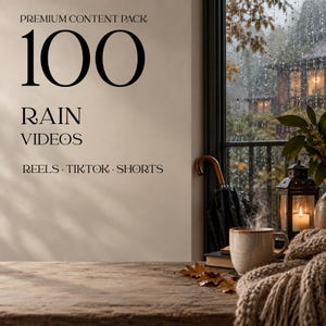 May include: A digital graphic featuring the text PREMIUM CONTENT PACK 100 RAIN VIDEOS REELS TIKTOK SHORTS. The scene shows a steaming mug, a lantern, a closed umbrella, and a knit blanket on a wooden table before a window with rainy weather.