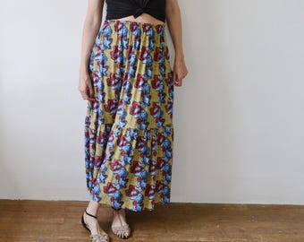 Falda larga de algodón estilo bohemio: estampado étnico en rojo, amarillo y azul, cintura elástica.