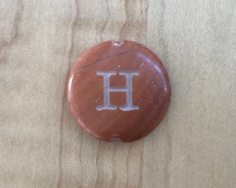 Stone with initial H