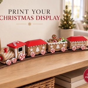 May include: A toy train set with a gingerbread theme, featuring a locomotive and three carriages on brown tracks. The train is decorated with red roofs, white peppermint-style wheels, and a gingerbread person figure. Text reads: PRINT YOUR CHRISTMAS DISPLAY and DIGITAL FILES ONLY.