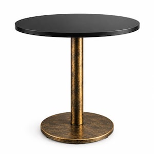 May include: A round table featuring a smooth matte black circular top supported by a single central cylindrical pedestal base with a textured antique bronze finish that matches the circular floor plate at the bottom of the table.