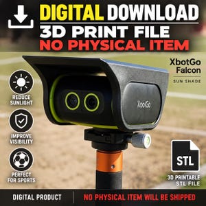 May include: A black and lime green XbotGo Falcon sun shade for a camera, featuring a digital download 3D print file. The device includes a lens hood, a mounting bracket with a silver adjustment knob, and an orange collar on the support pole.