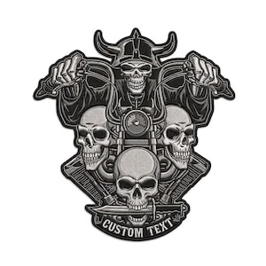 May include: A black and grey embroidered patch featuring a central skull wearing a horned helmet while riding a motorcycle. Two additional skulls flank the engine, and a third skull at the bottom holds a knife in its teeth with the text CUSTOM TEXT.