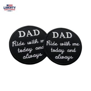 May include: Two circular black embroidered patches featuring white stitched text that reads DAD Ride with me today and always. The patches have a clean circular border and are designed for application onto fabric surfaces as decorative accents.