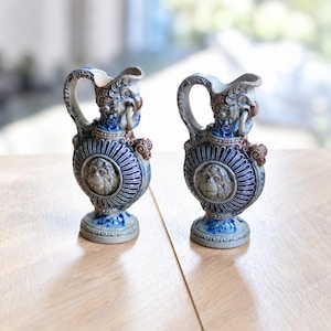Pair of Westerwald Stoneware Ewers, Blue and Grey Decorative Jugs with Face Medallions and Ring Masks, 18 cm
