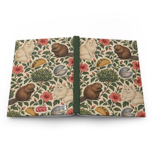 Supplier mockup showing the journal opened with both outer covers visible: botanical pattern on cream, a dark green spine, and a small CommonlyKnown logo near the bottom of the back cover. One journal; front and back shown together.