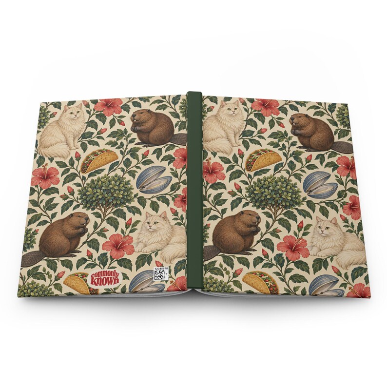 Supplier mockup showing the journal opened with both outer covers visible: botanical pattern on cream, a dark green spine, and a small CommonlyKnown logo near the bottom of the back cover. One journal; front and back shown together.