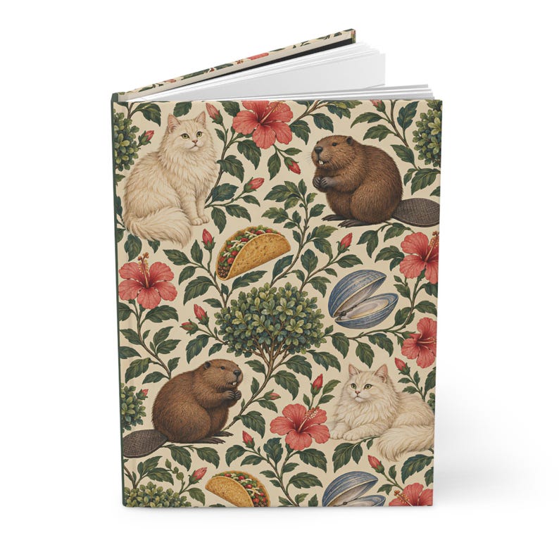 Angled supplier mockup of the botanical hardcover journal standing slightly open, showing the cream illustrated front cover, green foliage and pink flowers, with the white page block visible along the top edge.
