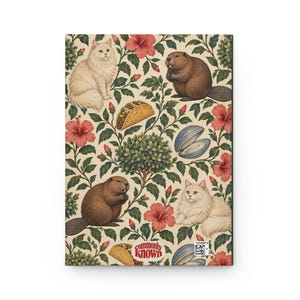 Back of the cream botanical hardcover journal, showing the repeating green foliage, cats, beavers, tacos, clams and pink flowers. Small red CommonlyKnown lettering sits in a rounded cream label near the bottom. Supplier product mockup.