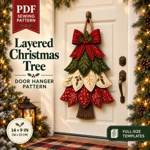May include: A PDF sewing pattern for a layered Christmas tree door hanger. The finished project is a fabric tree measuring 14 by 9 inches, featuring red, green, and cream leaf-shaped layers with decorative stitching and a brown trunk.