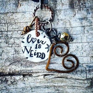 Love is Weird; mixed charm necklace