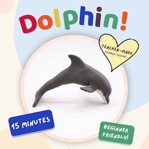 Könnte beinhalten: Eine digitale Anleitung mit dem Titel Polymer Clay Tutorial STEP-BY-STEP DOWNLOAD Dolphin! mit einer grauen Delfin-Skulptur aus Ton. Enthält die Texte 15 MINUTES, BEGINNER FRIENDLY!, TEACHER-MADE STUDENT-TESTED! in einem Herz und CLAYTIME ADVENTURES.