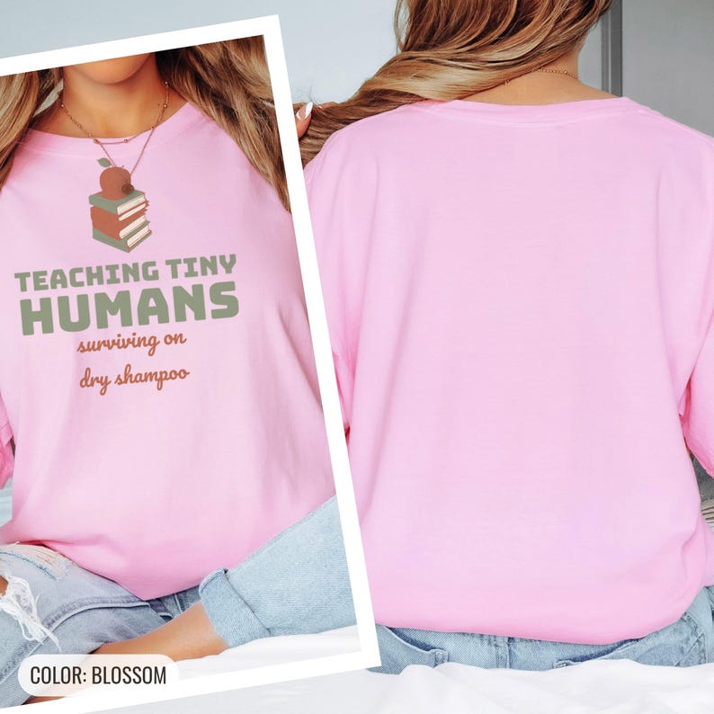 Blossom Comfort Colors t-shirt printed with the words Teaching Tiny Humans Surviving On Dry Shampoo and a drawing of a small neat stack of three closed hardcover books with PLAIN blank solid-colour spines an, worn by a woman