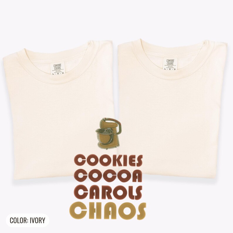 Ivory Comfort Colors t-shirt printed with the words Cookies Cocoa Carols Chaos and a drawing of a retro metal hand mixer with steel beaters, two matching shirts