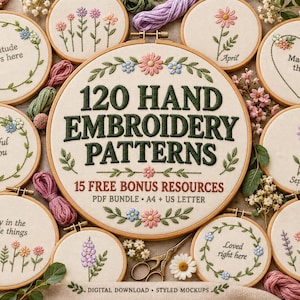 May include: A collection of circular wooden embroidery hoops featuring various floral designs and text including 120 HAND EMBROIDERY PATTERNS 15 FREE BONUS RESOURCES PDF BUNDLE A4 + US LETTER. The fabric is off-white with colorful thread.
