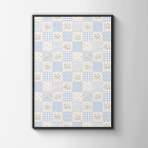 May include: A rectangular wall art piece in a black frame featuring a repeating patchwork pattern. The design consists of alternating squares in light blue and cream, decorated with floral motifs, small polka dots, and a classic gingham check.