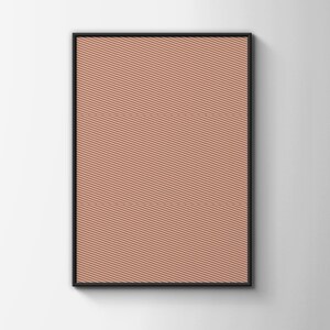 May include: A rectangular wall art piece featuring a terracotta-colored background covered in a pattern of thin, parallel white diagonal lines. The artwork is enclosed within a simple, thin black frame that borders the entire rectangular print.
