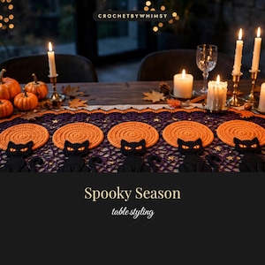 May include: A purple and orange crochet table runner featuring repeating motifs of black cats sitting in front of orange circular suns. The runner is decorated with small gold stars and text that reads CROCHETBYWHIMSY, Spooky Season, and table styling.