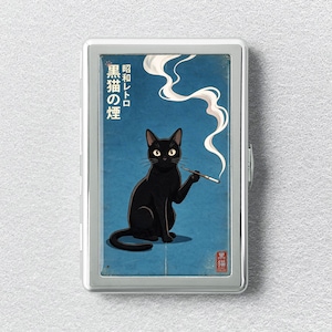 May include: A rectangular silver metal cigarette case featuring a graphic of a black cat holding a cigarette with rising smoke. The blue background includes Japanese text that reads Showa Retro Black Cat Smoke and a small red seal in the corner.