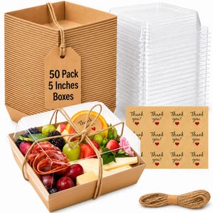 May include: A 50-pack of 5-inch square brown paper boxes with clear plastic lids, including a roll of jute twine, a sheet of circular brown stickers with the text Thank you! and a red heart, and one assembled box filled with charcuterie and fruit.