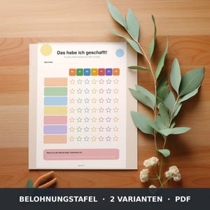 May include: A reward chart printed on white paper with the German text 'Das habe ich geschafft!', featuring a grid of colorful rows, columns labeled with days of the week, and empty star outlines for tracking tasks, with a reward line at the bottom.