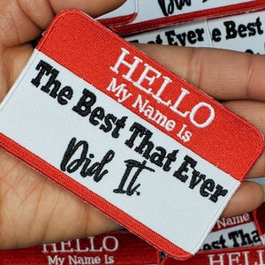 May include: Red and white name tag with the text "HELLO My Name Is The Best That Ever Did It."