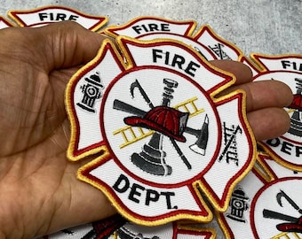 May include: A white, red, and gold firefighter patch with a fire hydrant, axe, ladder, and helmet in the center. The patch says "FIRE DEPT."
