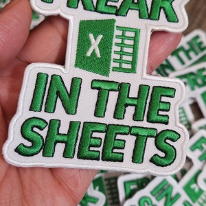 May include: Green and white embroidered patch with the text "FREAK IN THE SHEETS" and a green Microsoft Excel icon.
