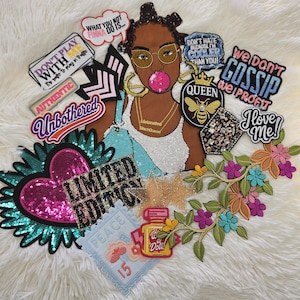 May include: A collection of embroidered and sequined patches featuring a central figure with glasses and bubblegum, surrounded by various text-based patches including "Don't Play With Me," "We Don't Gossip We Profit," "Limited Edition," and "Queen."