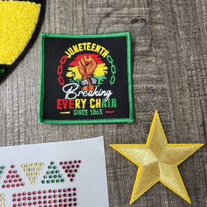May include: A green, black, and red embroidered patch with the words "Juneteenth Breaking Every Chain Since 1865" and a raised fist.
